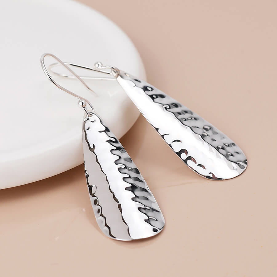 Sterling Silver Curved And Hammered Teardrop Earrings | The Jewellery Stop